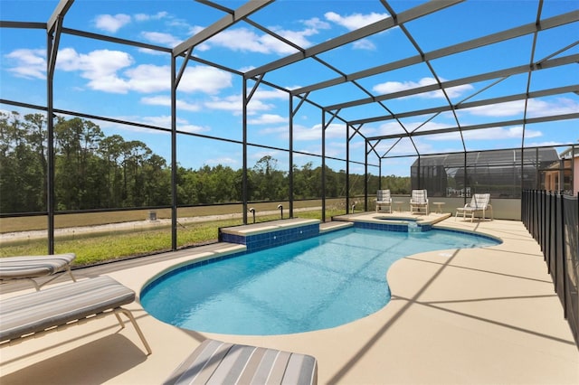 8571 La Isla Dr, Kissimmee, FL 34747 - view of swimming pool featuring a patio area, a pool with connected hot tub, and glass enclosure