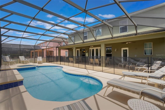 8571 La Isla Dr, Kissimmee, FL 34747 - view of swimming pool with ceiling fan, a patio area, a pool with connected hot tub, and a lanai