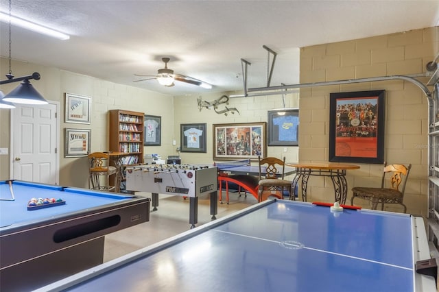 8571 La Isla Dr, Kissimmee, FL 34747 - playroom featuring concrete block wall, pool table, and a ceiling fan