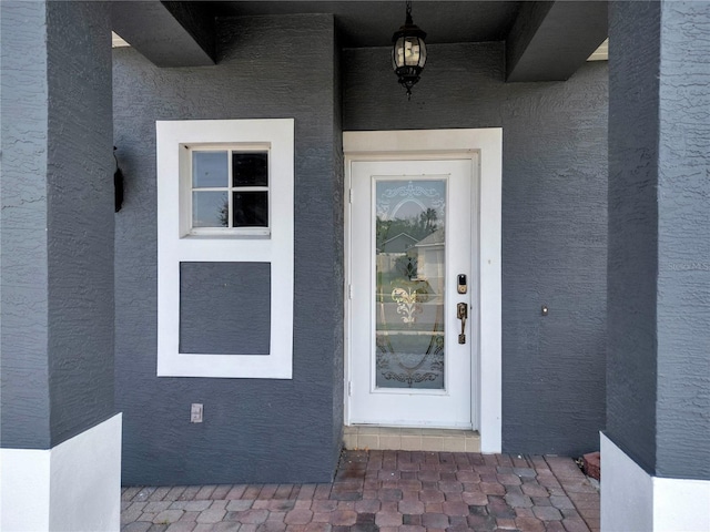 5768 Los Palma Vista Dr, Orlando, FL 32837 - doorway to property featuring stucco siding