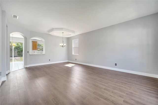 5768 Los Palma Vista Dr, Orlando, FL 32837 - empty room featuring a chandelier, dark wood-type flooring, and baseboards