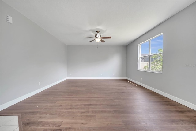 5768 Los Palma Vista Dr, Orlando, FL 32837 - empty room featuring a ceiling fan, wood finished floors, and baseboards