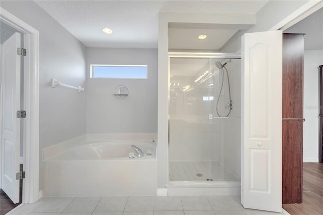 5768 Los Palma Vista Dr, Orlando, FL 32837 - full bathroom with a bath, a shower stall, and tile patterned floors