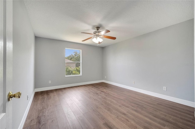 5768 Los Palma Vista Dr, Orlando, FL 32837 - unfurnished room featuring ceiling fan, dark wood-style floors, baseboards, and a textured ceiling