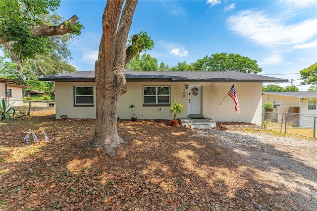 308 Forest St, Fruitland Park, FL 34731 - view of front of house with concrete block siding and fence