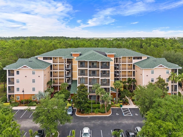 3060 Pirates Retreat Ct Unit 309, Kissimmee, FL 34747 - drone / aerial view of apartment complex and a heavily wooded area