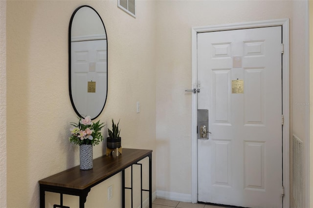 3060 Pirates Retreat Ct Unit 309, Kissimmee, FL 34747 - entryway featuring light tile patterned floors and baseboards