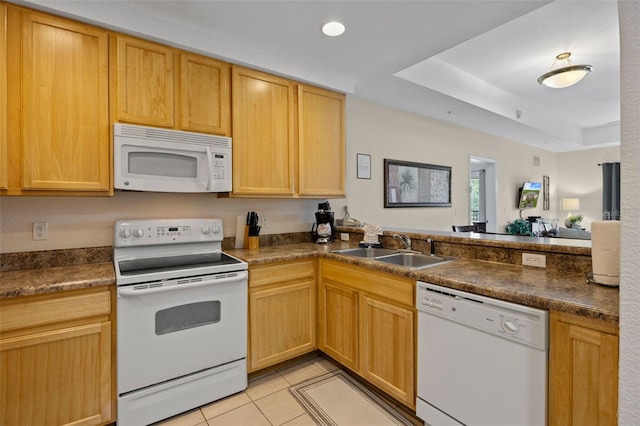 3060 Pirates Retreat Ct Unit 309, Kissimmee, FL 34747 - kitchen with white appliances, a sink, dark countertops, and light tile patterned floors