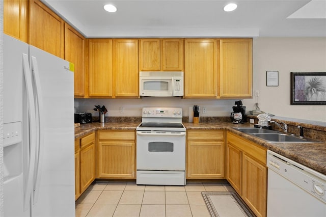 3060 Pirates Retreat Ct Unit 309, Kissimmee, FL 34747 - kitchen with white appliances, a sink, light tile patterned floors, dark countertops, and recessed lighting