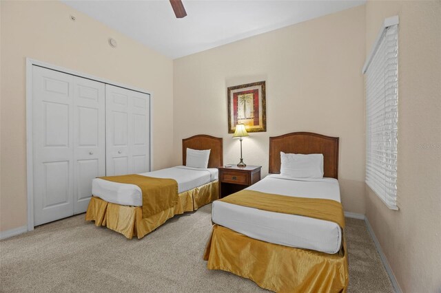 3060 Pirates Retreat Ct Unit 309, Kissimmee, FL 34747 - bedroom with carpet floors, a closet, baseboards, and a ceiling fan