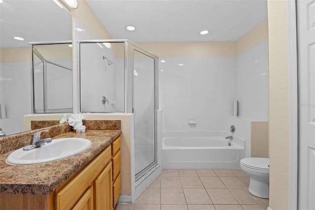 3060 Pirates Retreat Ct Unit 309, Kissimmee, FL 34747 - full bath with tile patterned flooring, a shower stall, vanity, toilet, and a garden tub