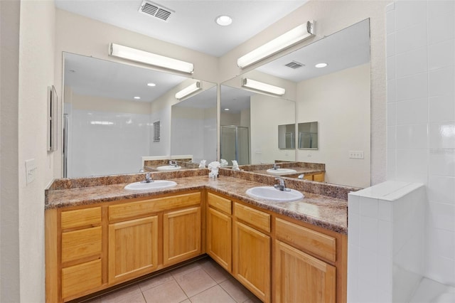 3060 Pirates Retreat Ct Unit 309, Kissimmee, FL 34747 - full bath with a stall shower, double vanity, tile patterned floors, and recessed lighting
