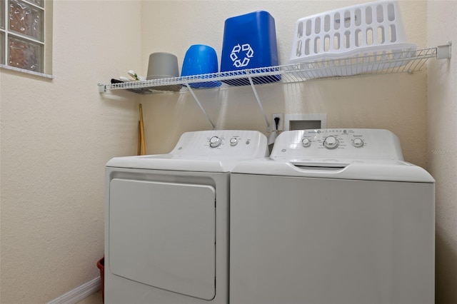 3060 Pirates Retreat Ct Unit 309, Kissimmee, FL 34747 - laundry area featuring washer and dryer, a textured wall, and baseboards