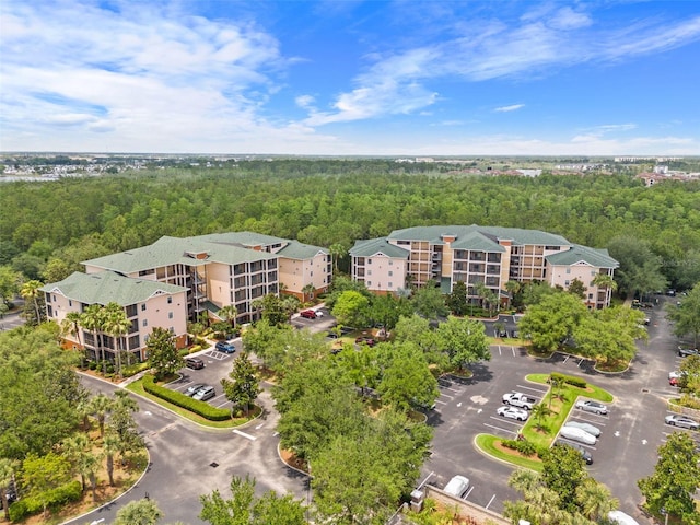 3060 Pirates Retreat Ct Unit 309, Kissimmee, FL 34747 - drone / aerial view of a heavily wooded area and apartment complex / building