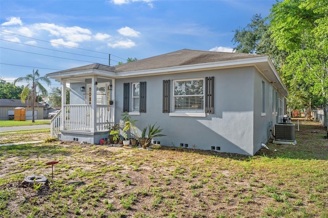 1024 Cohassett Ave, Lake Wales, FL 33853 - view of front facade featuring central air condition unit and stucco siding