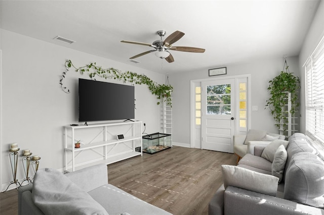 1024 Cohassett Ave, Lake Wales, FL 33853 - living area with a ceiling fan, wood finished floors, plenty of natural light, and baseboards