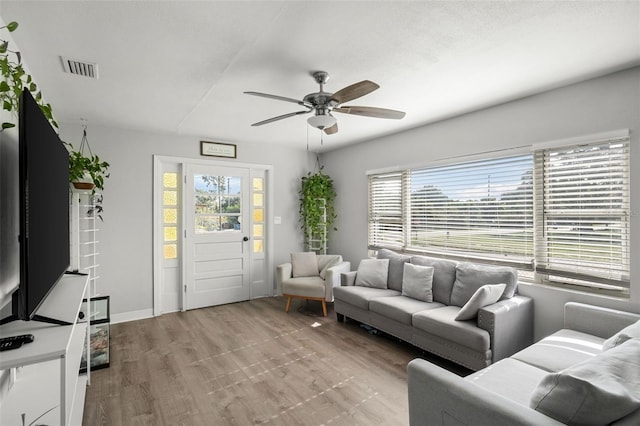 1024 Cohassett Ave, Lake Wales, FL 33853 - living room featuring a ceiling fan and light wood-style flooring