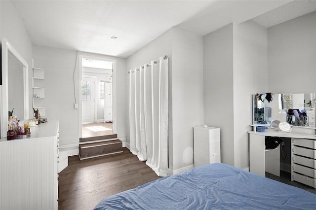 1024 Cohassett Ave, Lake Wales, FL 33853 - bedroom with dark wood-type flooring and baseboards