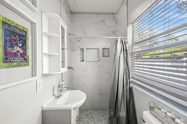 1024 Cohassett Ave, Lake Wales, FL 33853 - bathroom with a marble finish shower, vanity, and toilet