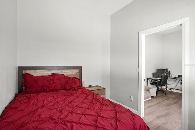 1024 Cohassett Ave, Lake Wales, FL 33853 - bedroom featuring wood finished floors and a desk
