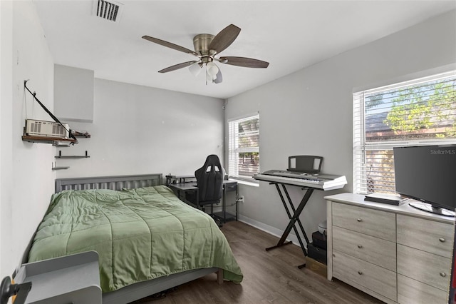 1024 Cohassett Ave, Lake Wales, FL 33853 - bedroom featuring dark wood finished floors, baseboards, and ceiling fan