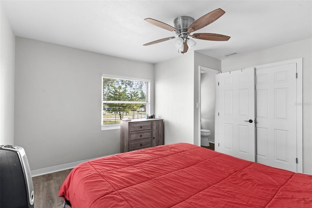 1024 Cohassett Ave, Lake Wales, FL 33853 - bedroom featuring wood finished floors, baseboards, ceiling fan, and ensuite bath