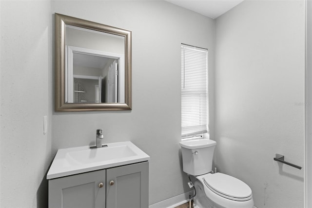 1024 Cohassett Ave, Lake Wales, FL 33853 - bathroom with toilet, vanity, and baseboards