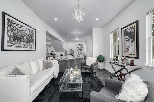 423 Arbor Cir, Celebration, FL 34747 - living area with stairs, a chandelier, recessed lighting, wood finished floors, and baseboards