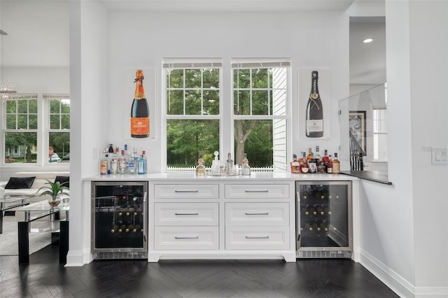 423 Arbor Cir, Celebration, FL 34747 - indoor dry bar with wine cooler, healthy amount of natural light, and baseboards