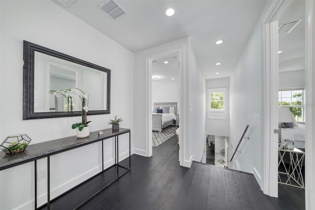 423 Arbor Cir, Celebration, FL 34747 - corridor with an upstairs landing, dark wood finished floors, baseboards, and recessed lighting