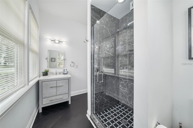423 Arbor Cir, Celebration, FL 34747 - full bathroom featuring a marble finish shower, vanity, and baseboards