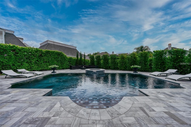 423 Arbor Cir, Celebration, FL 34747 - view of swimming pool featuring a pool with connected hot tub and a patio area