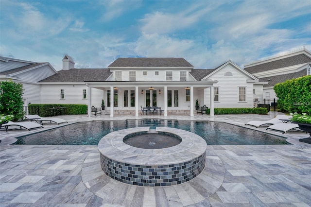 423 Arbor Cir, Celebration, FL 34747 - view of pool with fence, a pool with connected hot tub, and a patio