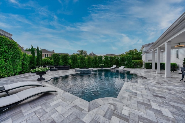 423 Arbor Cir, Celebration, FL 34747 - view of swimming pool featuring a patio area and a pool with connected hot tub