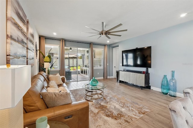 living room with a ceiling fan, light wood-style flooring, baseboards, and recessed lighting