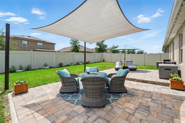 view of patio featuring outdoor dining area and central AC