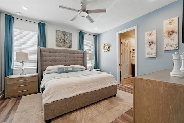 bedroom with light wood-type flooring, a ceiling fan, and recessed lighting