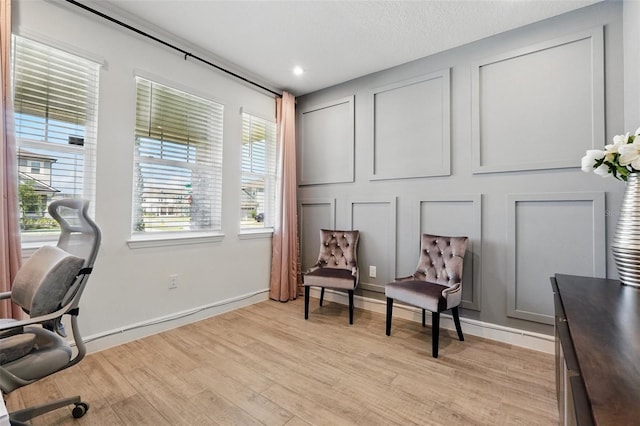 home office featuring light wood-style floors and baseboards