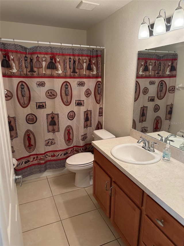 369 St Georges Cir, Eagle Lake, FL 33839 - bathroom with vanity, a textured wall, and tile patterned floors