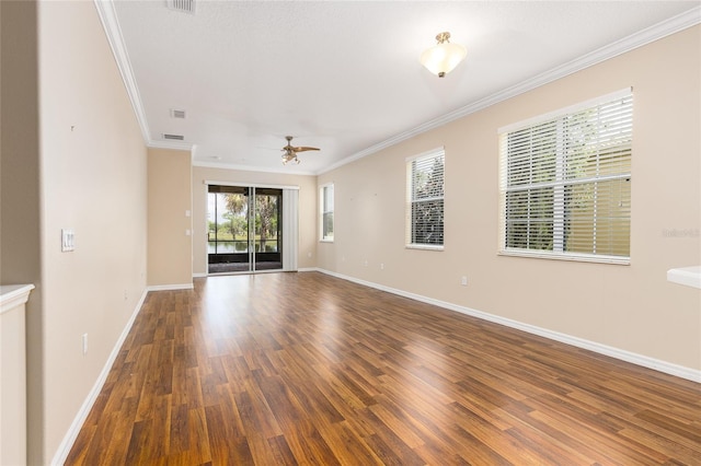 2376 Palm Tree Dr, Kissimmee, FL 34759 - unfurnished room with wood finished floors, ornamental molding, a ceiling fan, and baseboards