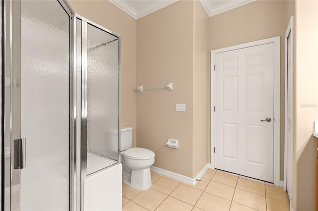 2376 Palm Tree Dr, Kissimmee, FL 34759 - bathroom with crown molding, tile patterned flooring, toilet, a stall shower, and baseboards