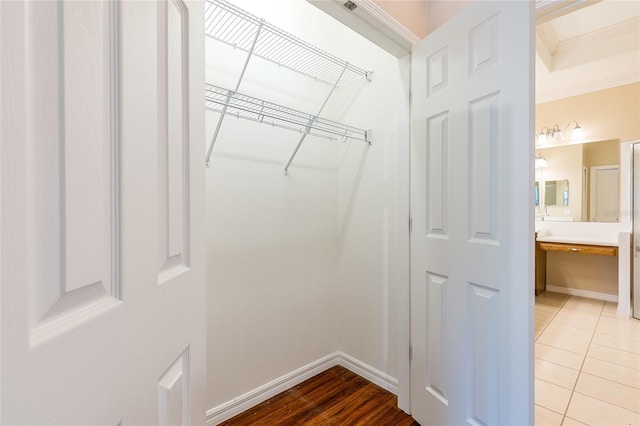 2376 Palm Tree Dr, Kissimmee, FL 34759 - walk in closet with light tile patterned flooring