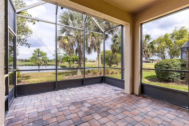 2376 Palm Tree Dr, Kissimmee, FL 34759 - unfurnished sunroom with a water view