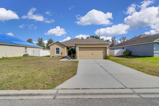 561 Lake Cummings Way, Lake Alfred, FL 33850 - single story home featuring a garage, driveway, central AC, and stucco siding
