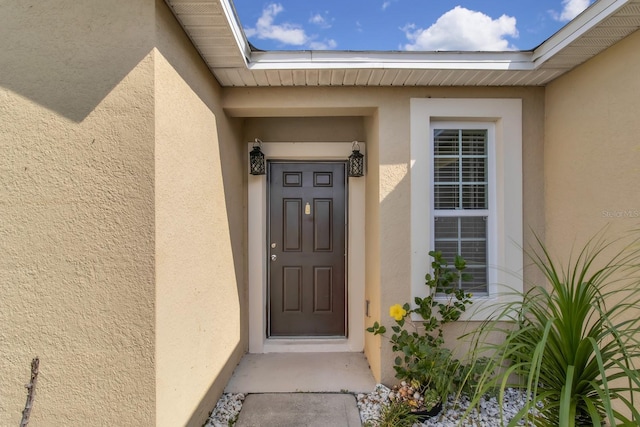 561 Lake Cummings Way, Lake Alfred, FL 33850 - entrance to property featuring stucco siding