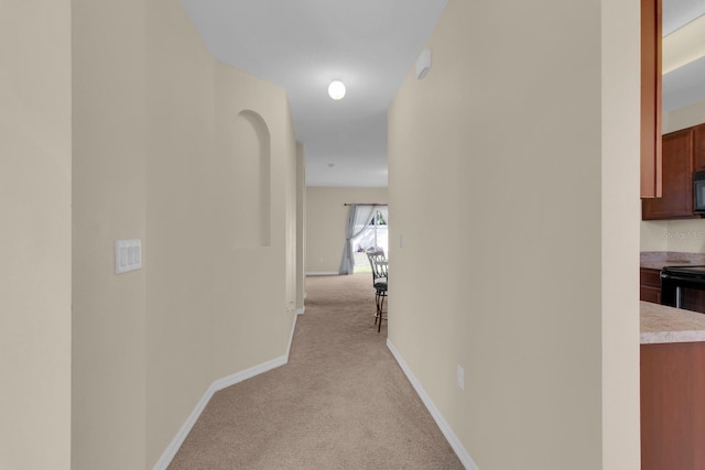 561 Lake Cummings Way, Lake Alfred, FL 33850 - hallway with light colored carpet and baseboards