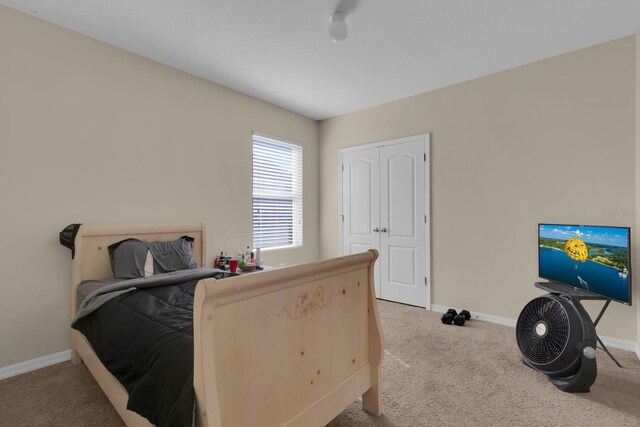 561 Lake Cummings Way, Lake Alfred, FL 33850 - carpeted bedroom featuring baseboards