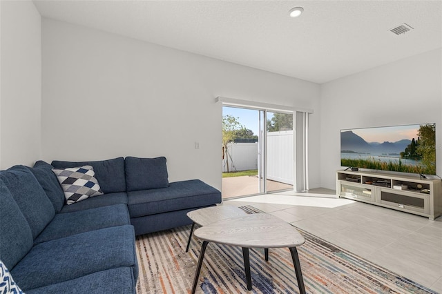 living area featuring tile patterned floors