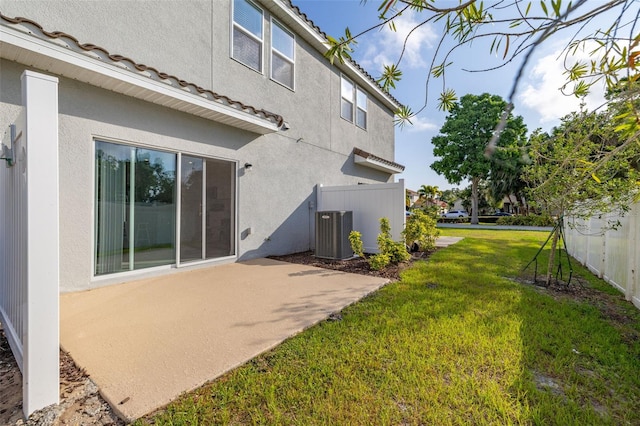 back of house featuring central air condition unit, a patio, and stucco siding