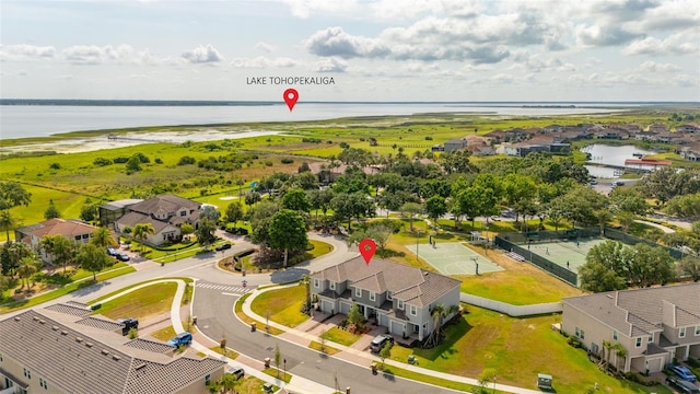 aerial perspective of suburban area featuring a nearby body of water